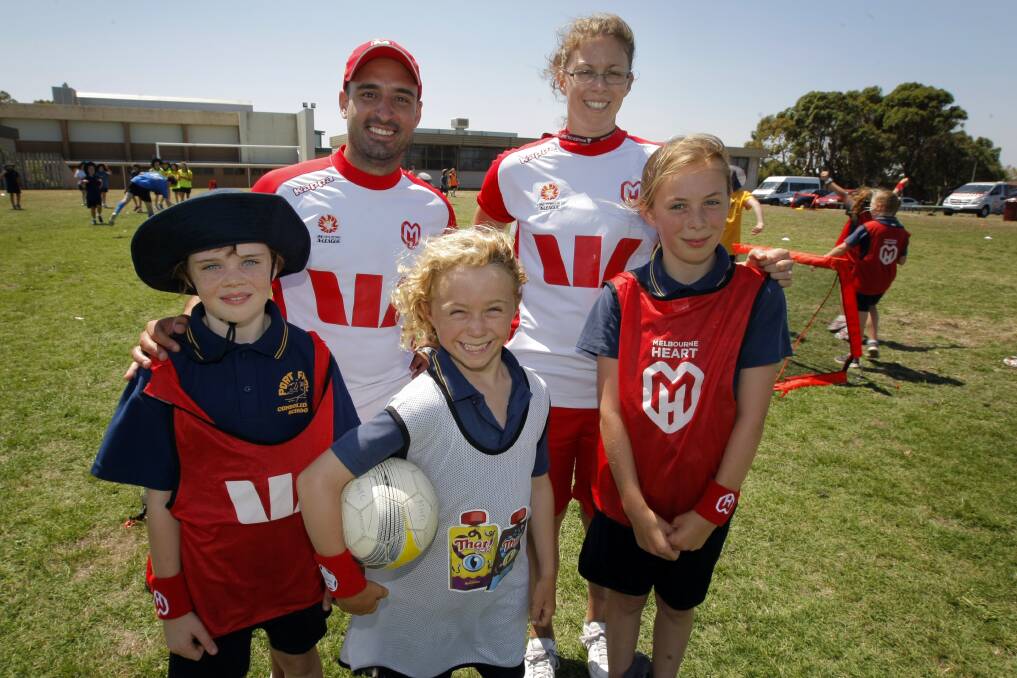 Port Fairy Consolidated Primary School students Niamh Howard (left), 9, Paddy Conlan, 9, and Millie Kenna, 9, with Melbourne Heart FC game development officers Josh Bondin and Louisa Bisby. 