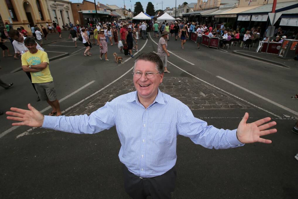 Victorian Premier Denis Napthine embraces the folk ambience of Port Fairy in the main street. 