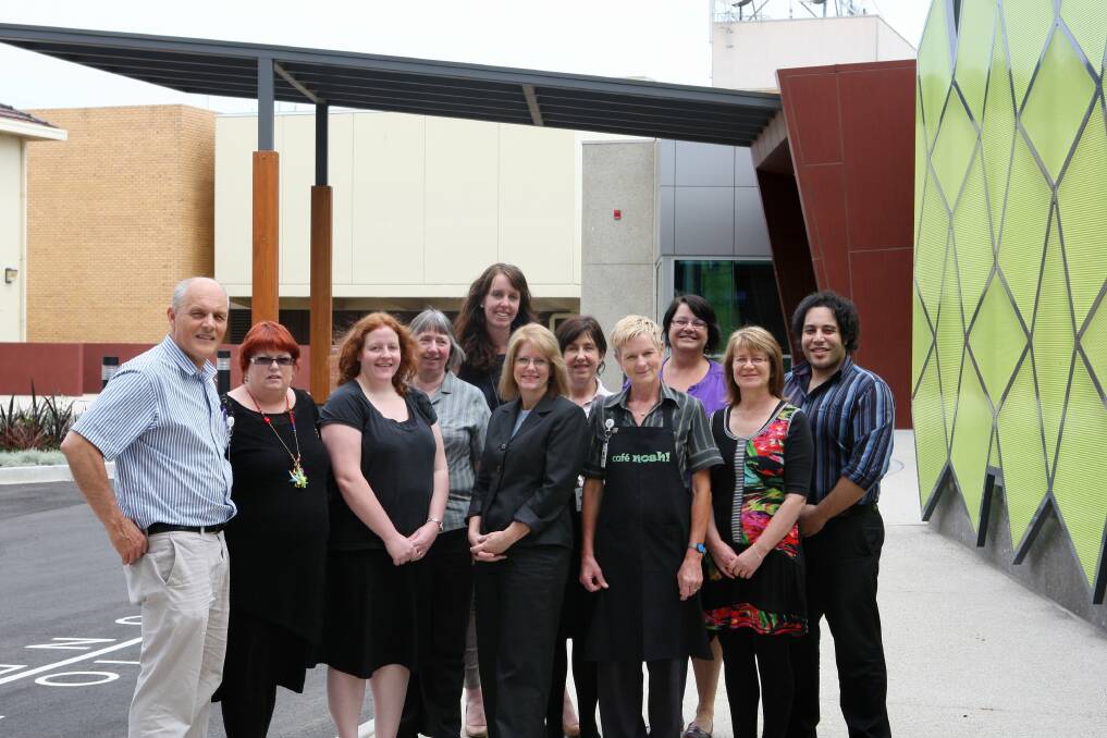 Staff members gather in front of South West Healthcare’s new allied health wing entrance on Koroit Street.    
