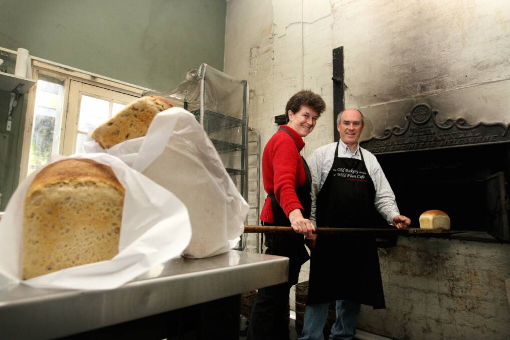 Pauline Yule and Paul Sanders tend the wood-fired ovens at The Old Dunkeld Bakery and Wild Plum Cafe, where they make sourdough bread.  