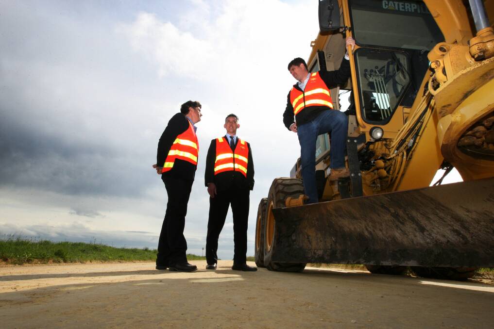 Developer Tony Herbert (left), mayor Michael Neoh and Winslow Constructions project manager Rhyce Milward on Horne Road yesterday.  