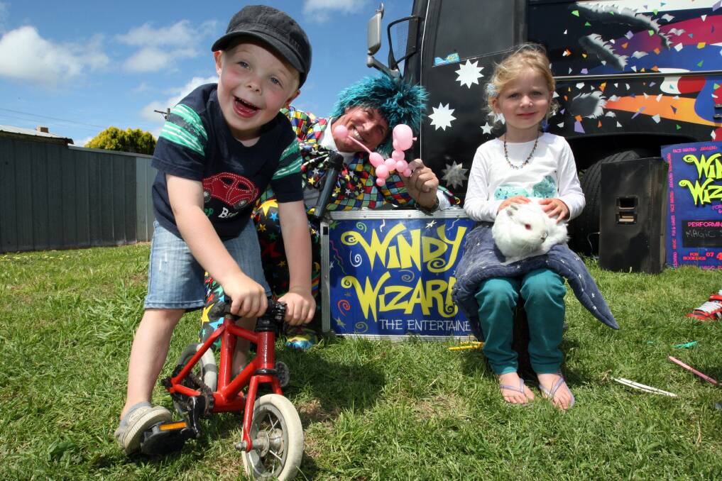 Windy Wizard weaves his magic smiling spell on Lenny Carey, 4, of Southern Cross, and Anja Kuzma, 4, from Warrnambool. 