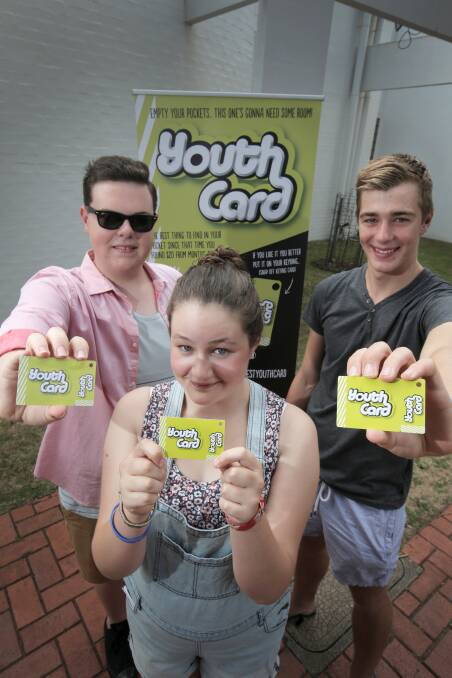 Youth councillors Declan Primmer, 16 (left), Bonnie McKenzie, 15, and Taylor Johnstone, 15, check out the new South West Youth Card. 