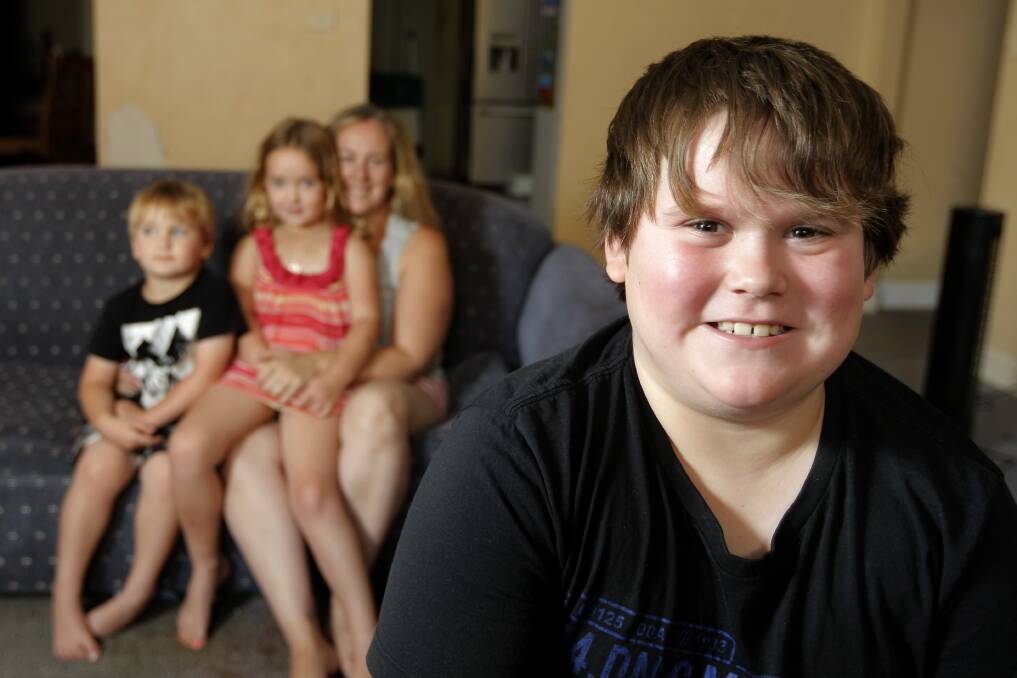 Lachlan Jackson, 9, of Dennington, is happy to be at home with (back l-r) Bailey, 3, Chelsea, 6, and mum Andrea Norris after a life-threatening emergency. 