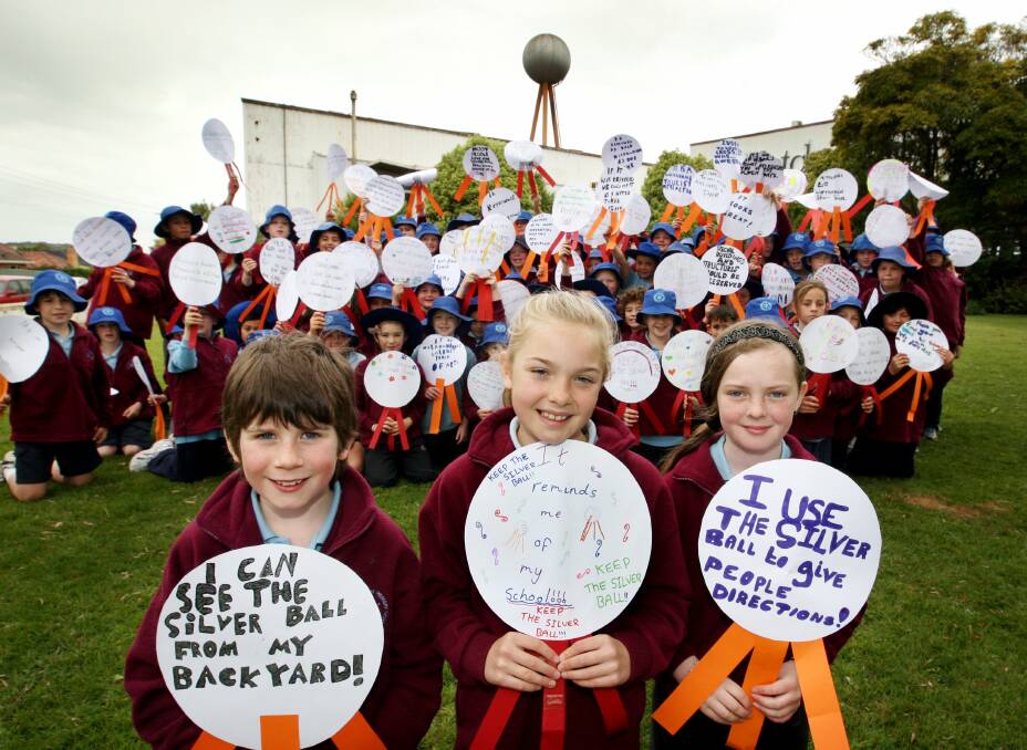 It’s been a landmark on the horizon all their lives. Now Warrnambool East Primary School grade 3 and 4 pupils Merlin Clare, 8 (left), Grace Farrer, 10,  Sophie Mansbridge, 10, and their classmates  have joined the push to save the old Fletcher Jones factory silver ball water tower.