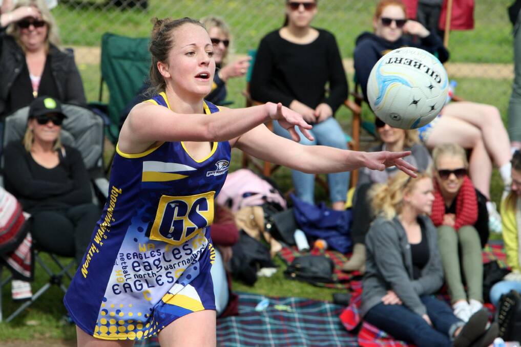 North Warrnambool Eagles' Laura Blackburn gets a pass away. Pictures: DAVE LANGLEY
