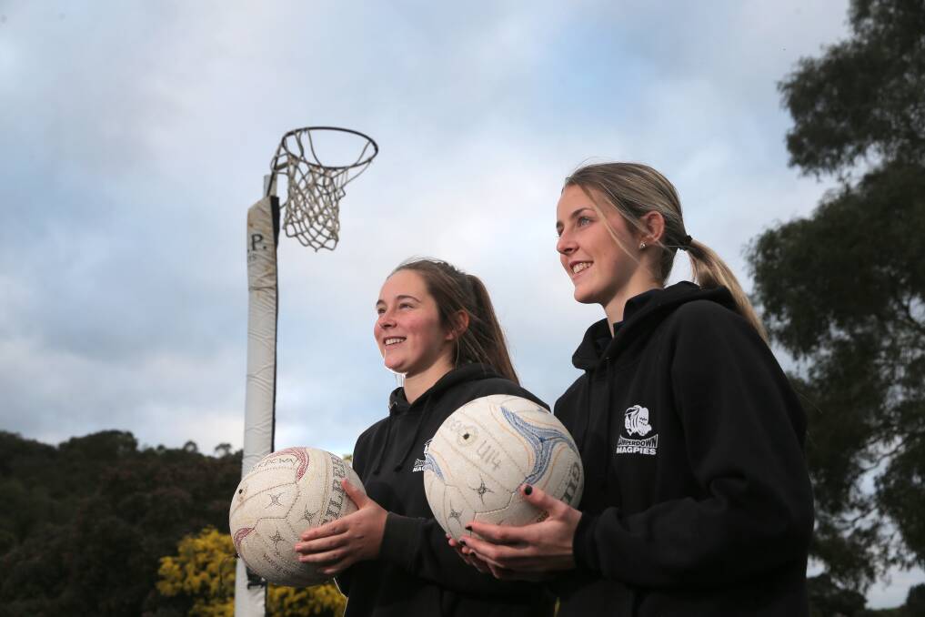 Camperdown’s Finch sisters, goal shooter Emily (left), 17, and goal attack Jaymie, 19, honed their skills under the net at home.140814RG20 Picture: ROB GUNSTONE