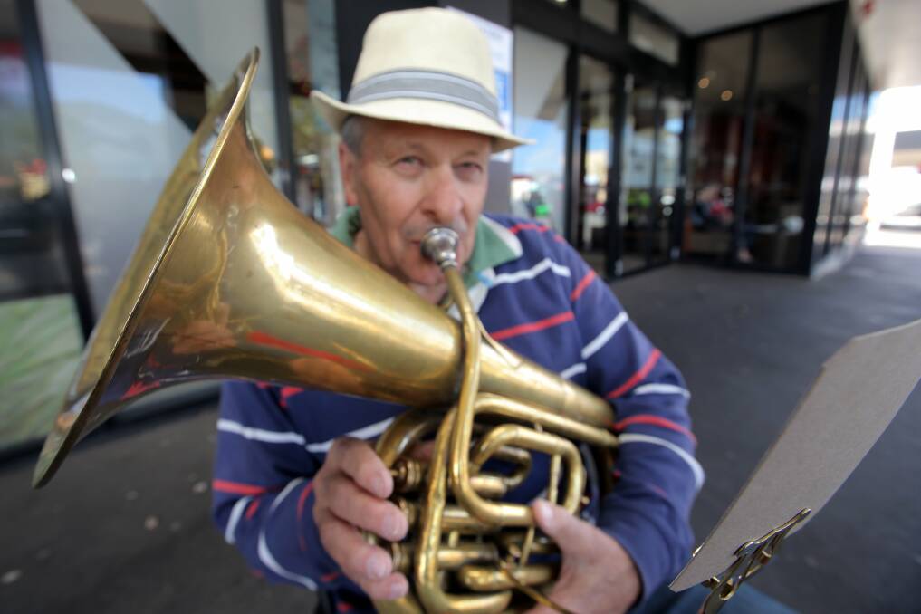 Former Warrnambool City Council CEO and first-time busker Lindsay Merritt plays his vintage euphonium at the Koroit Street entrance to Target to raise money for Peter’s Project. The instrument was used in the First World War.