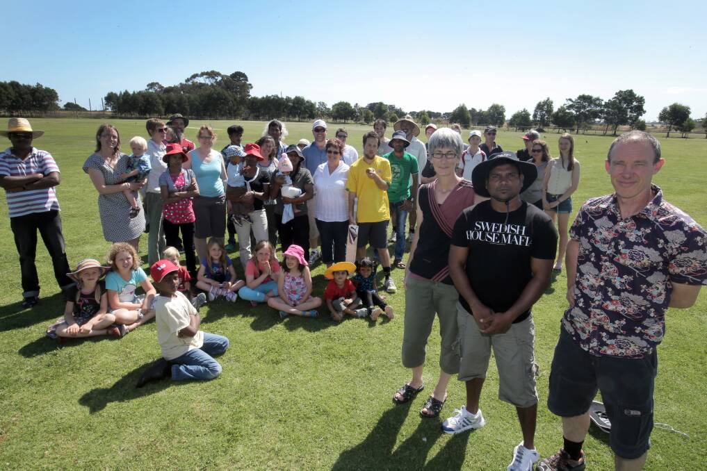 Bowled over by kindness: Warrnambool resident Katherine Stewart (front, left), Sri Lankan refugee Kandee and organiser Don Stewart with local supporters and other Sri Lankan refugees at the Wangoom oval yesterday. 