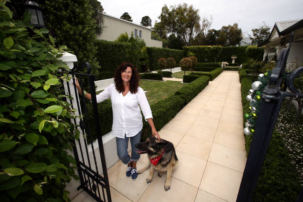 Sandra Jans and her dog Bella open their garden to the public during Port Fairy Rotary Club’s fund-raising event on the weekend. 