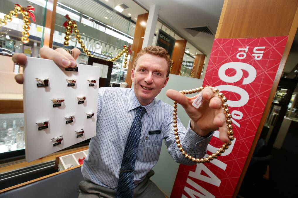 Thomas Jewellers Warrnambool manager Peter McLauchlan shows what’s on offer for Boxing Day sales.