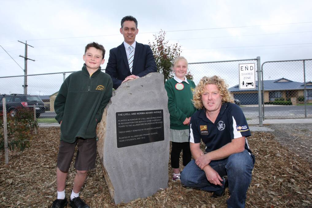 Ethan Boyd, 9, of Allansford Primary School (left), Warrnambool mayor Michael Neoh, Ashlee Lowe, 8, of Allansford Primary School, and Allansford Football Netball Club president Nathan Adams help mark the opening of the Lyell and Norma Adams Avenue.