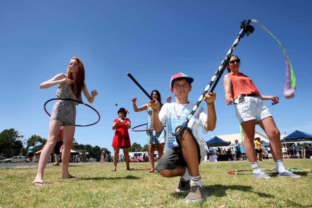 Lauren Simpson, 15, from Narrawong, joins Di Paulger from the First Light Entertainment Circus workshop, Rebecca Bourke, 16, from Portland, Sam Butterworth, 11, from Birregurra and Melanie Dyson, 15, from Tyrendarra in the hula hoop and poi twirling workshop at the show. 