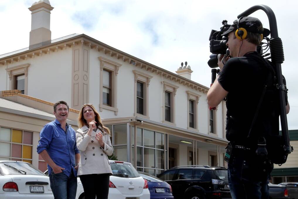 Warrnambool comedian Dave Hughes and TV host Julia Zemiro take a tour of Emmanuel College yesterday, filmed by camera operator Darrell Martin for an episode of Julia Zemiro’s Home Delivery, to screen on ABC1 next year. 