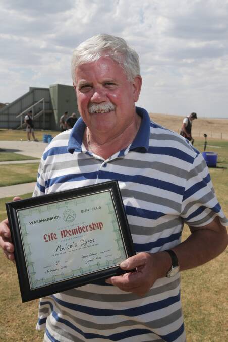 Warrnambool Clay Target Club’s Malcolm Dyson with his life membership award. 