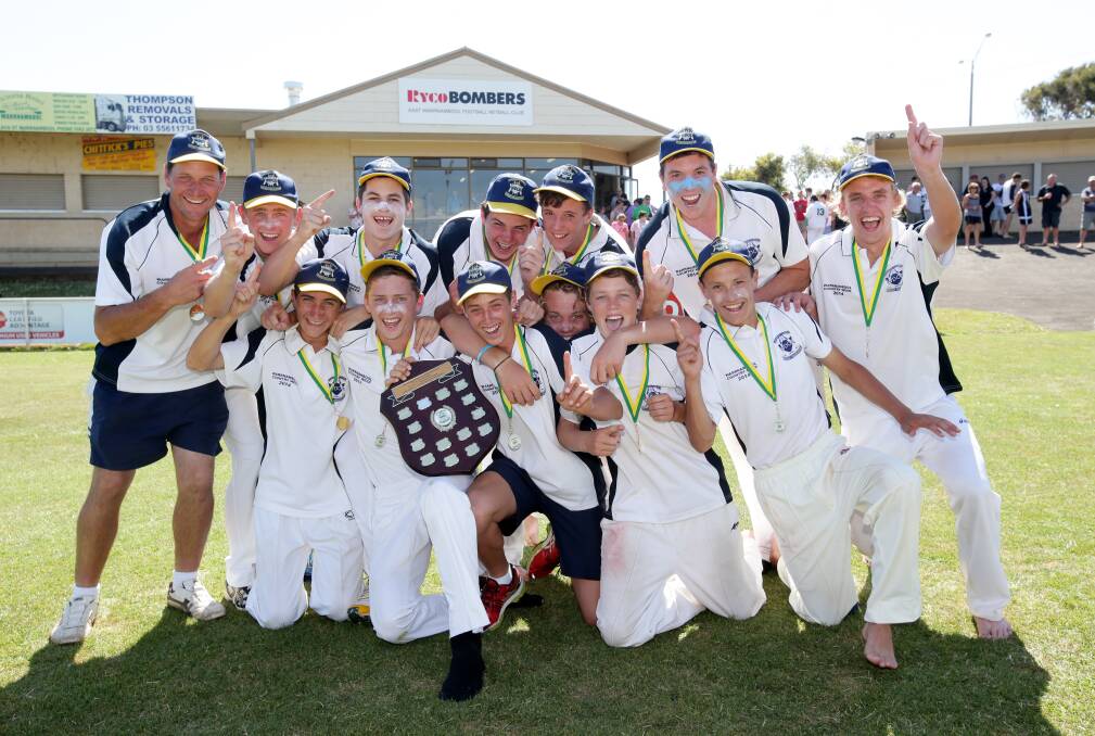 Warrnambool Blue players share the jubilation of under 17 division one Country Week shield success after winning a tight final against Warrnambool Gold yesterday at Reid Oval. 