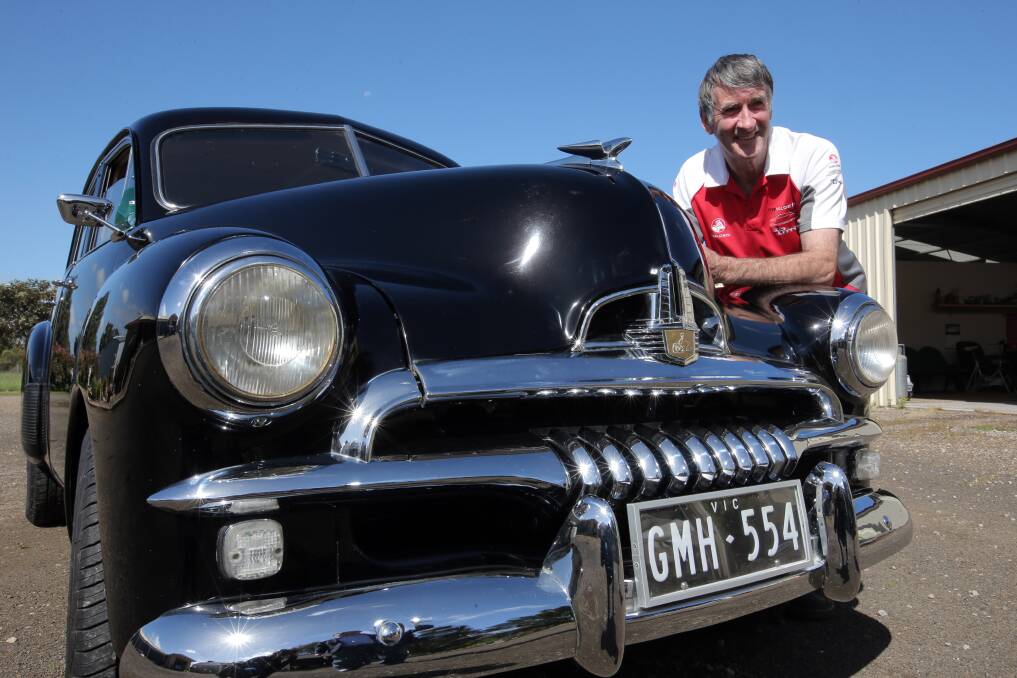 Bushfield Holden enthusiast Ivan McGinness with his restored 1954 FJ, “a top-quality vehicle Australia could be proud of”.