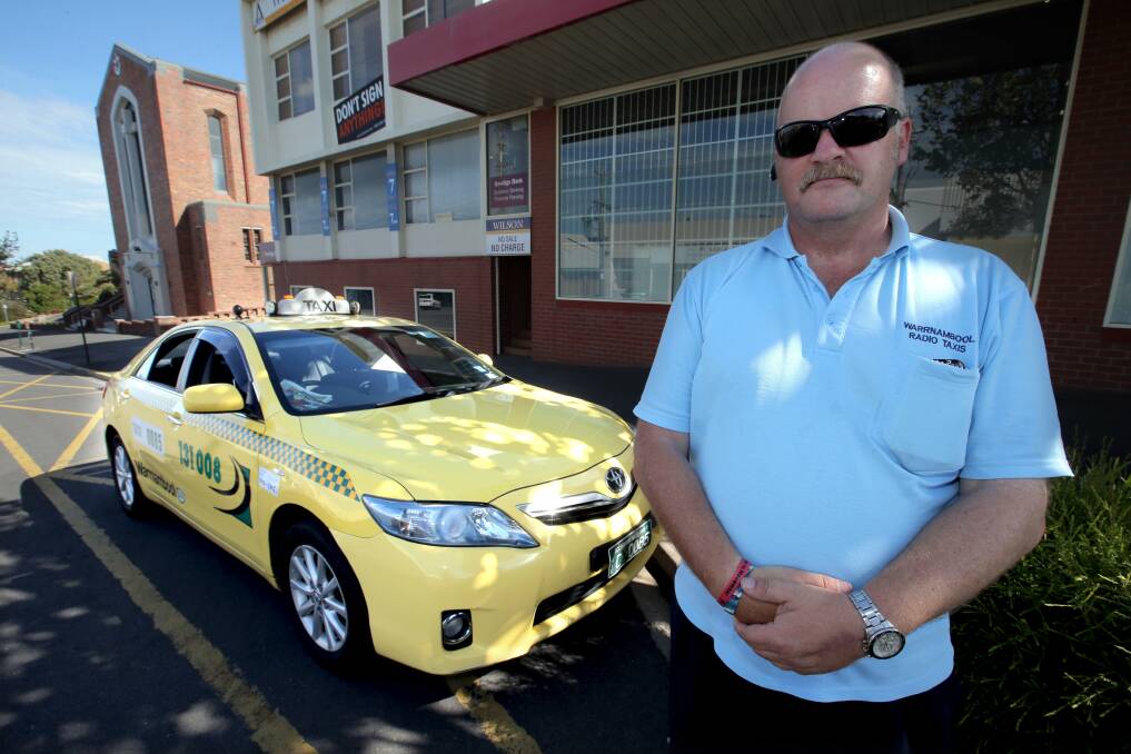  Warrnambool taxi driver Rob Brittain with a Toyota Camry Hybrid fleet vehicle — now the first choice of taxi companies.