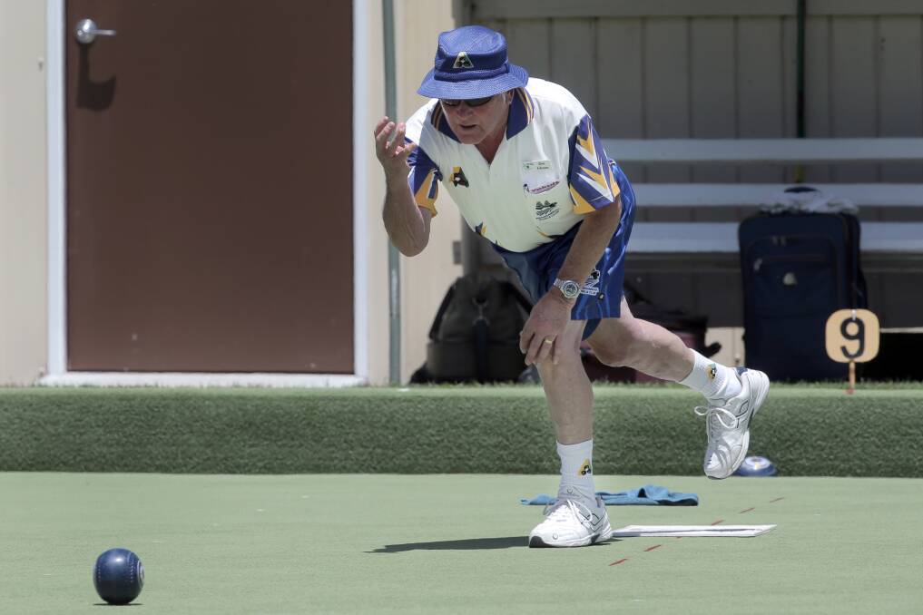 Warrnambool White skip Don Johnson maintains a nice balance as he bowls in his rink’s victory against Terang Green on Saturday.
