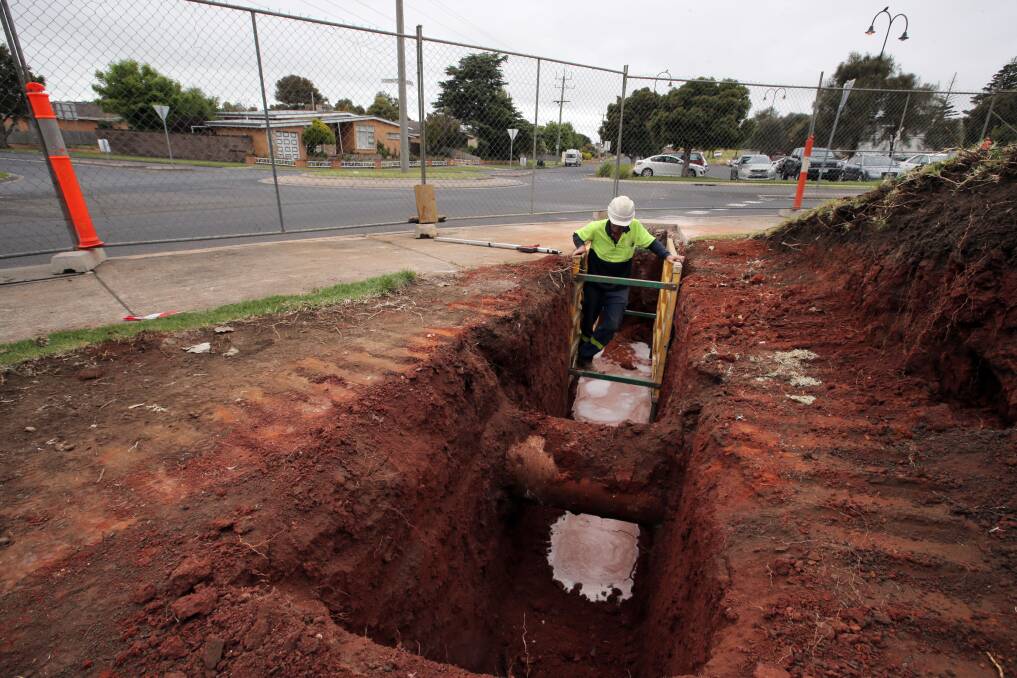 Trevor Moulsdale, from Cri-tech Plumbing, inspects pipeline boring work along Botanic Road which will eventually carry water to the North of the Merri residential zone. 