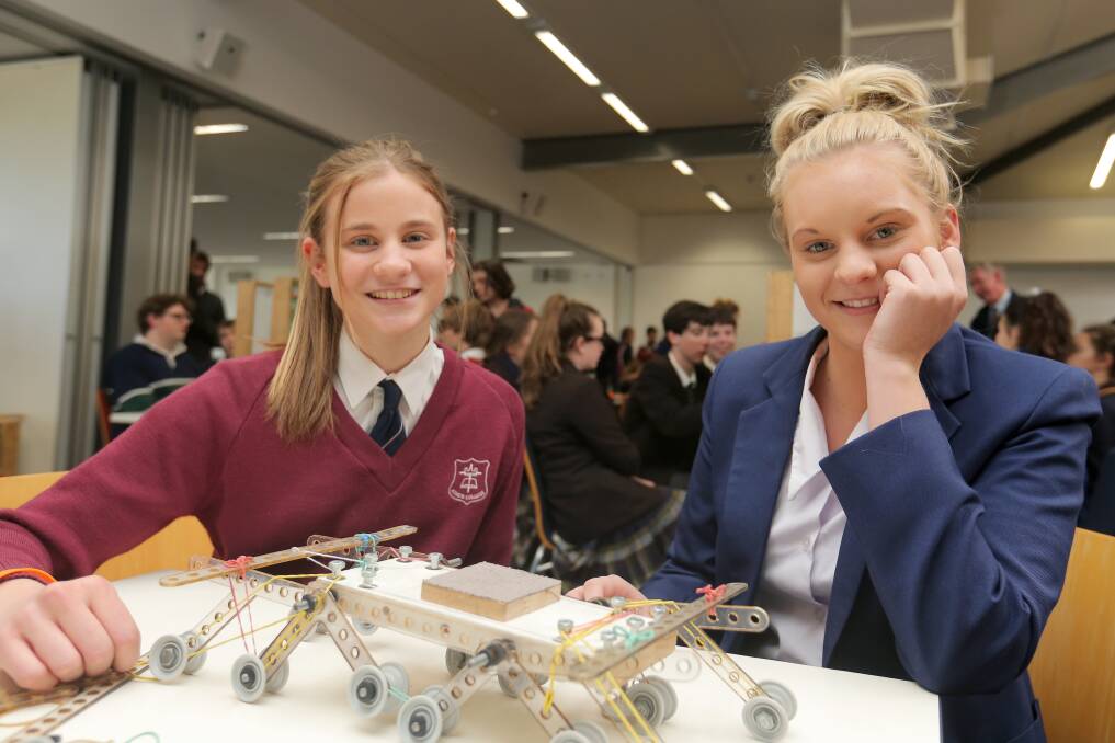 King’s College year 10 students Louisa Ballinger, 16, (left) and Emma Askew, 16, built this rover at yesterday’s science challenge. 140812RG04 Picture: ROB GUNSTONE