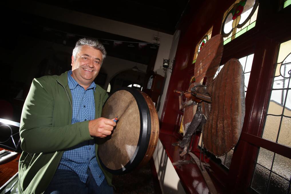Leamon Chambers tests a Bodhran drum at Mickey’s Bourke Koroit Hotel in preparation for today’s return of the Koroit Lake School of Celtic Music.
