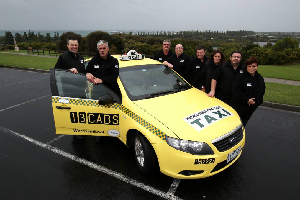 13 CABS chief operating officer Stuart Overell (left) with Warrnambool cab operators Rod Woodbridge (back, left), Jamie Woodbridge, Darryl Williams, Brett Crowther, Carol Oakley, Troy Worland and Conny Dittmar who have signed on for the new booking and despatch service. 