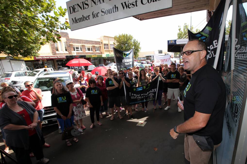 Emmanuel College teacher and union representative Mick Barling gets the message across to Warrnambool teachers during yesterday’s protest rally outside the office of South West Coast MP Denis Napthine.