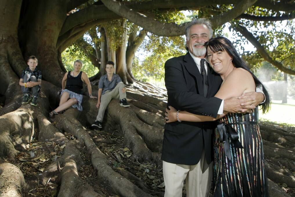 Newlyweds Michael and Trish Sagripanti embrace in the shade of a Moreton Bay fig tree at the Warrnambool Botanic Gardens after specifically choosing yesterday’s unique date to tie the knot. Their children Tom Carroll, Haylee Barker and Danny Carroll enjoyed the special day. 