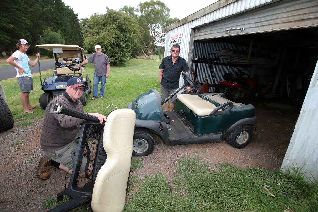 Camperdown Golf Club members inspect some of the golf carts taken for joy rides and damaged, from left, Troy Stephens Darren Frost, Bernie Sinnott and Ross Hughes. 130101DW12 Picture DAMIAN WHITE