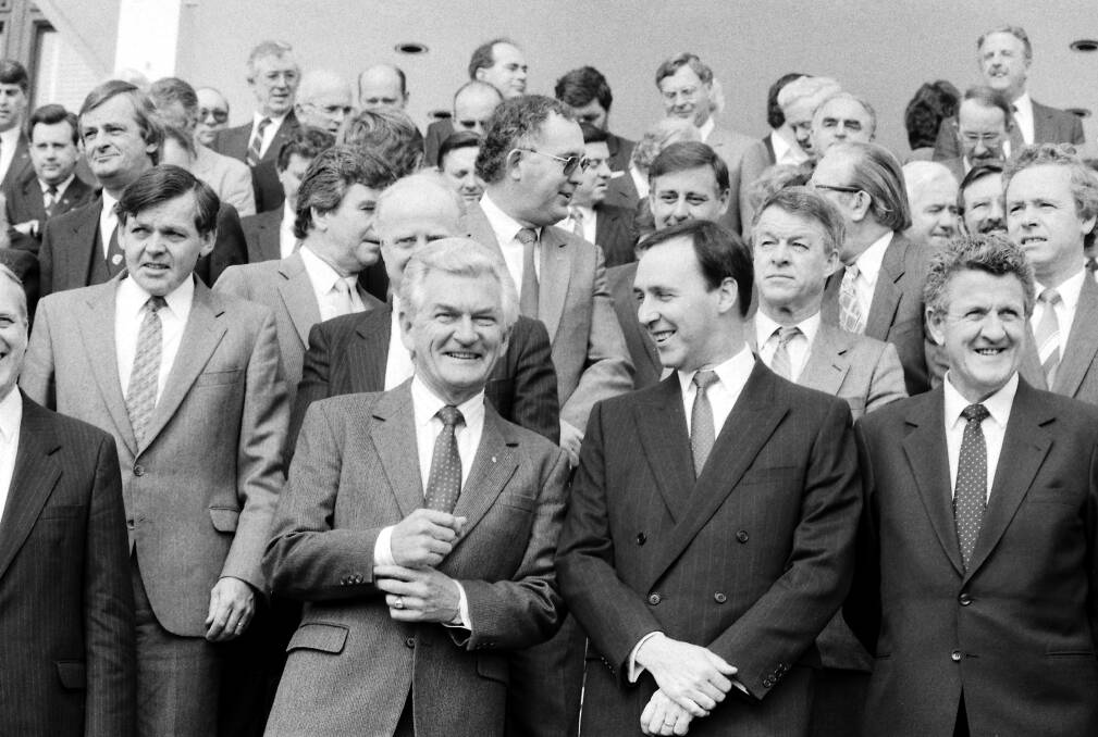 Prime Minister Bob Hawke and Federal Treasurer Paul Keating, pictured with the Hawke Cabinet outside Parliament House Canberra on 15 September 1987. They are flanked by Mick Young and John Dawkins. SMH NEWS Picture by DAVID BARTHO 