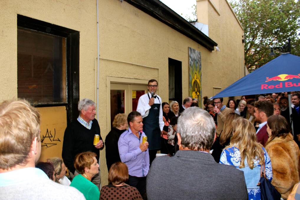 Edward Mahony welcomes guests at the launch of his pop-up bar on Friday night