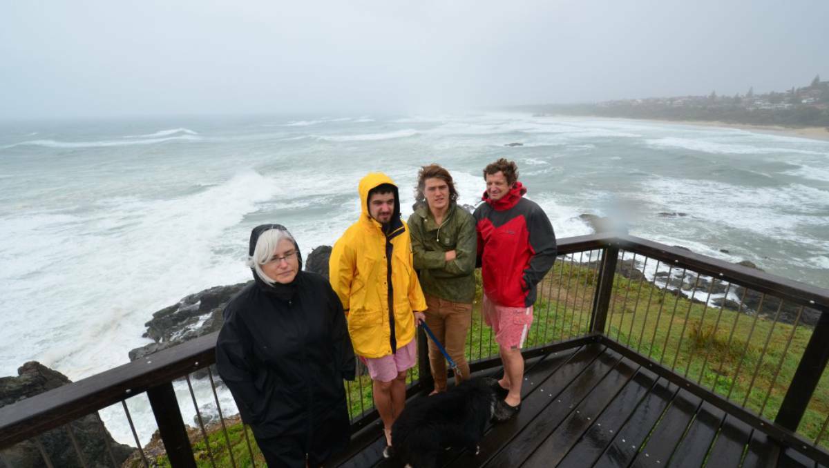 Louise Dix, with Joe, Roland and Nick Bullock (and dog Charlie) at the viewing platform at Lighthouse Beach on Monday. Photo: Port Macquarie News