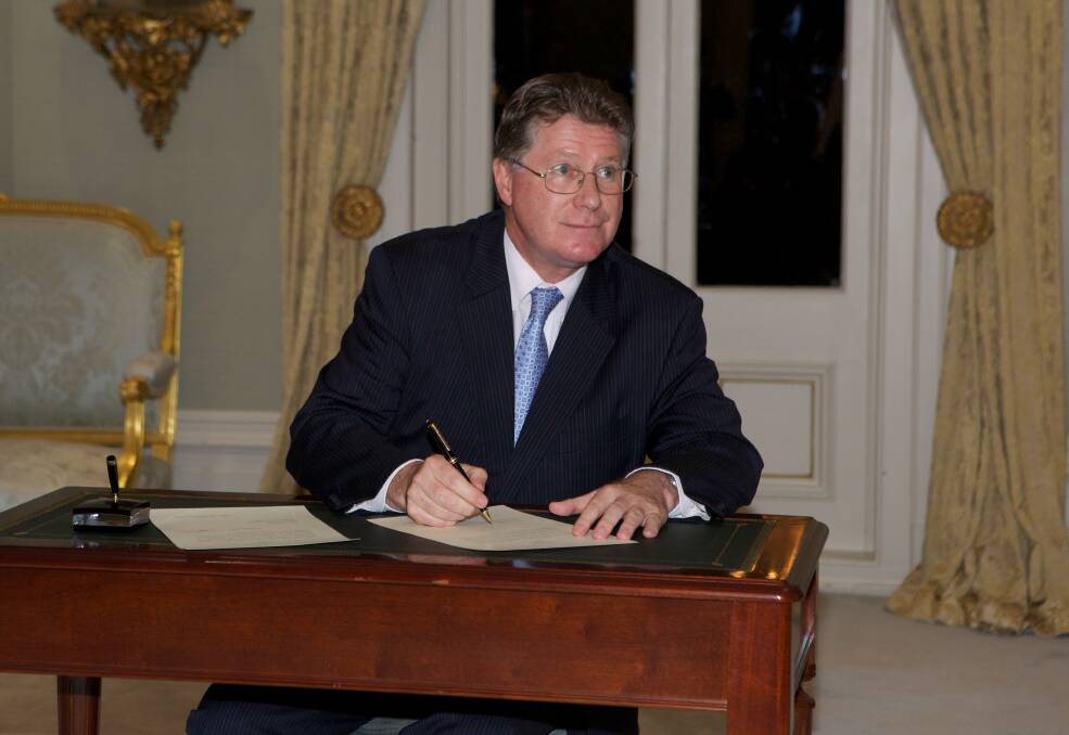 Dennis Napthine being sworn in at Government house on Wednesday night. Photo: Paul Jeffers