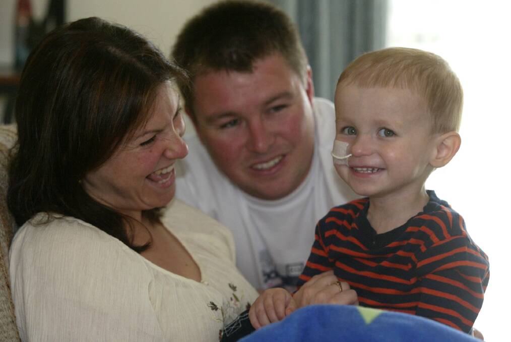 Narelle and Shane Brooks with their two-year-old son Jesse, who is battling cancer.