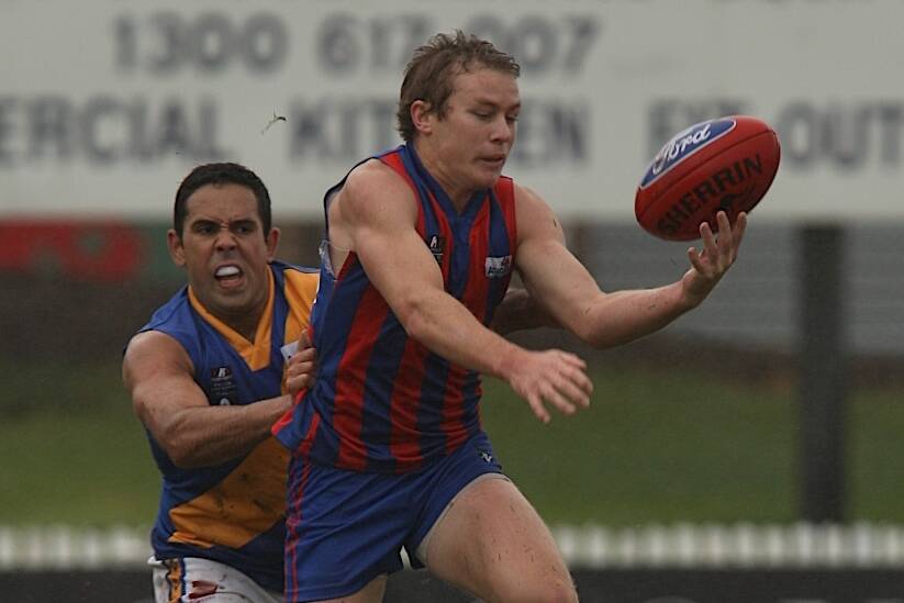 Sam Dwyer, selected by Collingwood in today's draft, escapes the grip of Brett Goodes, drafted by Western Bulldogs.