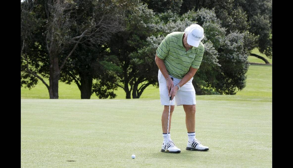 Andrew Suggett, of Warrnambool, rolls his putt towards the hole. 