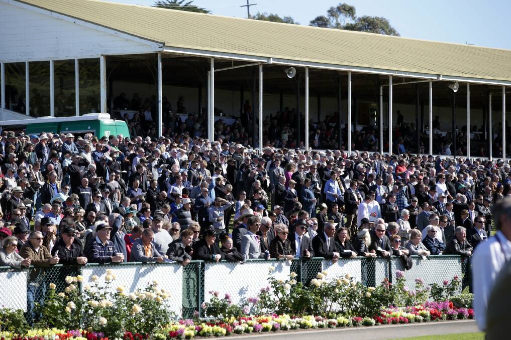 Some of the attentive May Racing Carnival crowd.