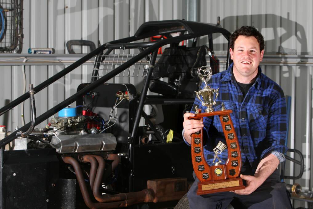 Winner of the 2012-2013 Victorian Super Rod Association Aggregate, Dale Wash, with his racecar and trophy. Picture: DAVE LANGLEY