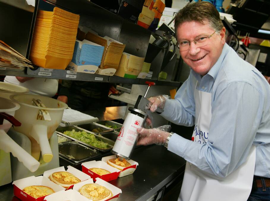 Denis Napthine cooking burgers for McHappy Day in 2008.