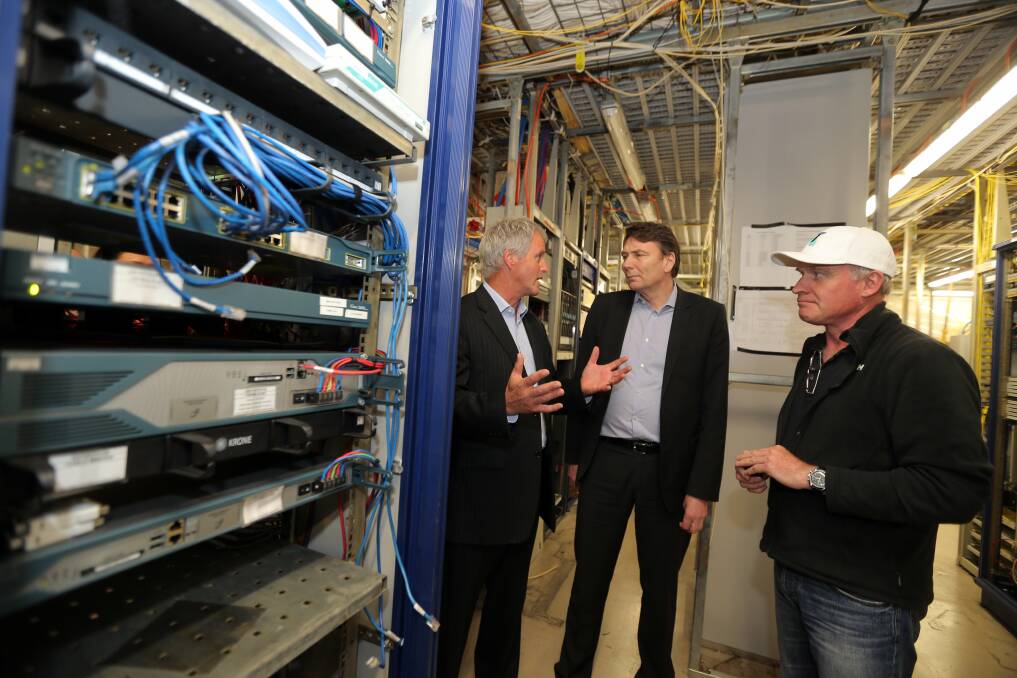 David Thodey inspecting the Warrnambool exchange building and speaking to Regional manager Bill Mundy and regional systems director Bob Beresford.