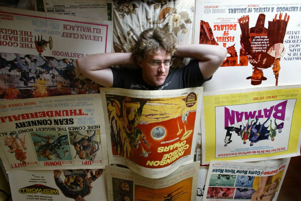 Rick Bayne with a few of his hundreds of movie posters, from classics to modern.
