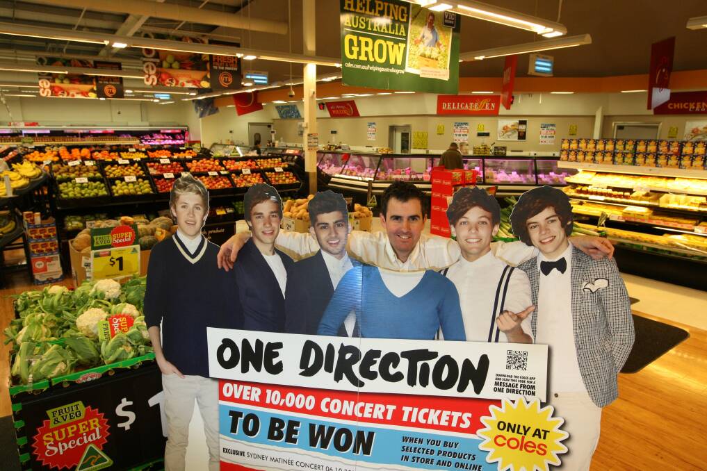 Coles Centro Warrnambool manager Glenn Rayner with the One Direction cut-out to be auctioned for Peter's Project. Picture:LEANNE PICKETT