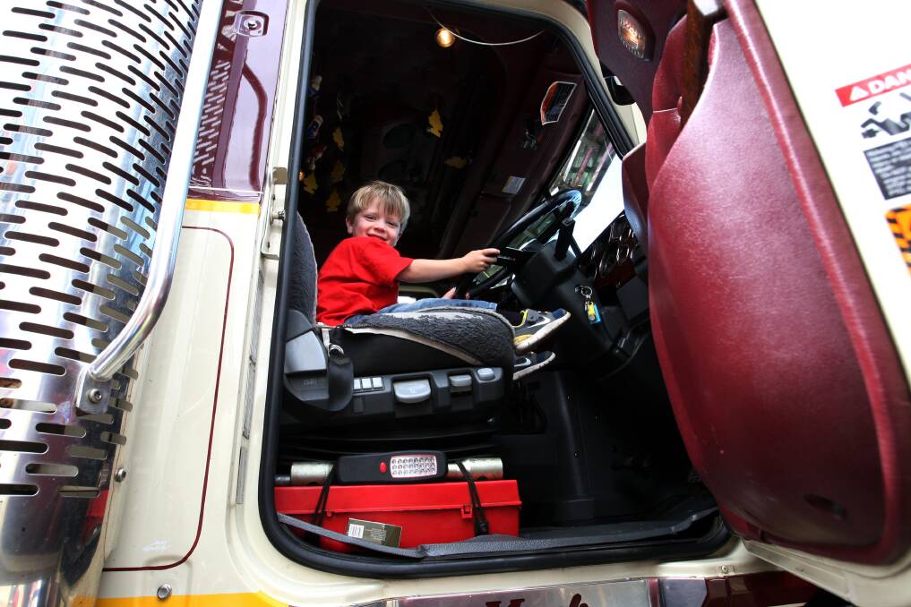Harry Haylock, 3, from Port Fairy tries out at a Mack truck owned by Boyles Livestock in Mepunga.