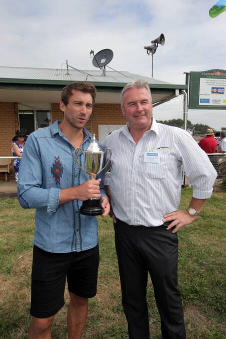 Geelong footballer Corey Enright with Turf President Laurie Hickey.