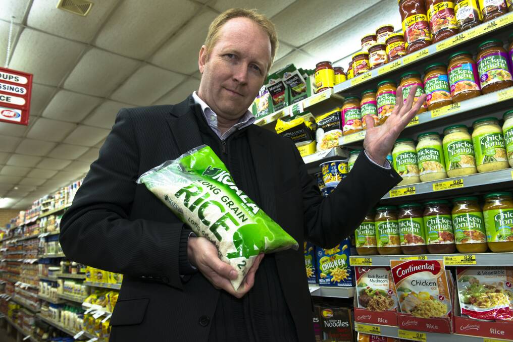 Victorian Greens leader Greg Barber with a very Australian-sounding brand of rice, complete with Koala logo, which is actually made from "Australian and imported rice".