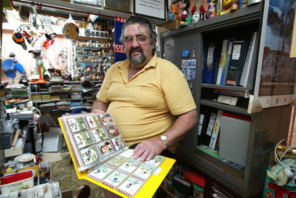 Neville Johnston with his collection of trading cards.