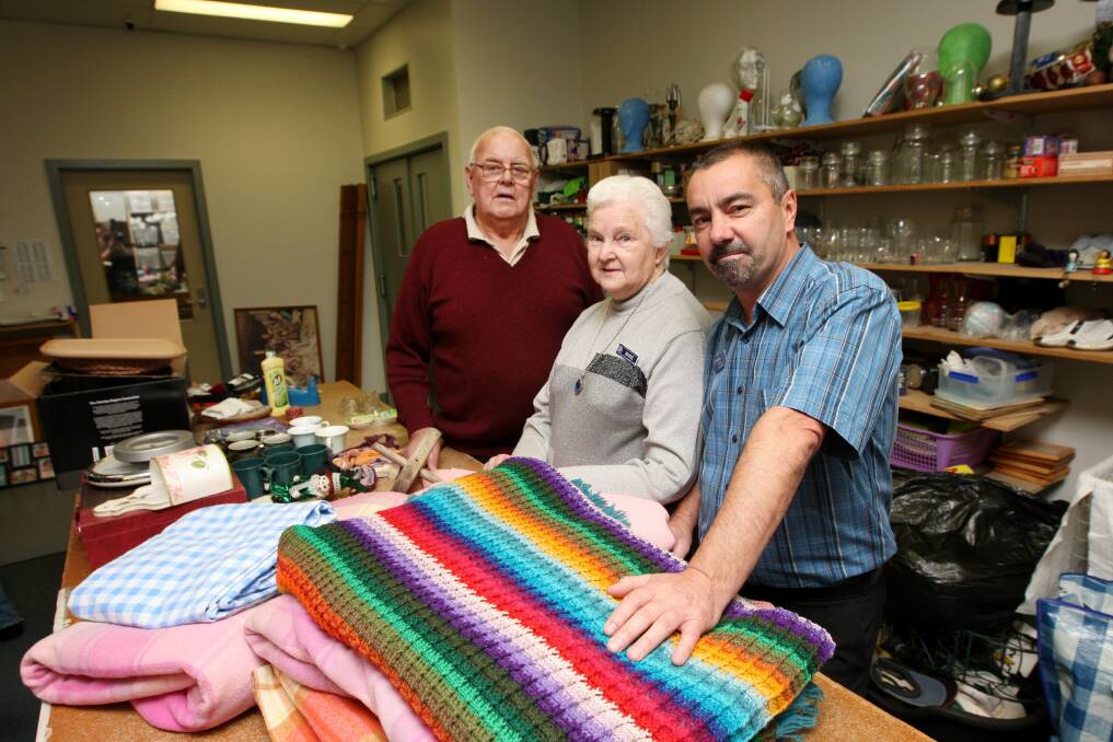 Demand for welfare is increasing, particularly for those on Newstart. Pictured are St Vinnie's volunteers Jack Daffy, Marie Garner, and centre manager Kevin Bond.