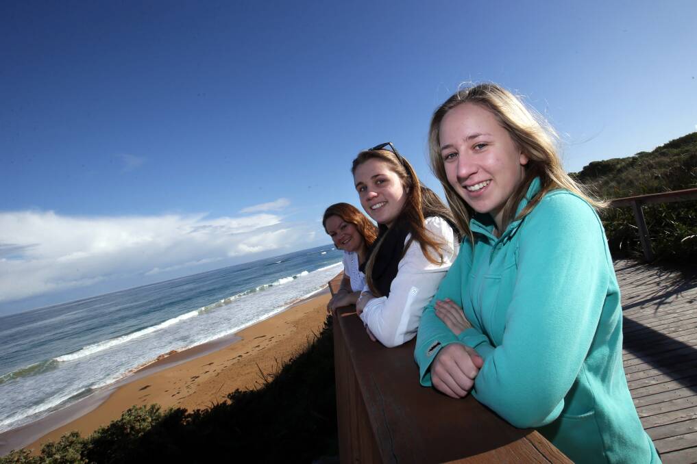 Deakin Uni students Bree Hanson, Madi Bishop and Georgie Smith whale watching at Logan's Beach.