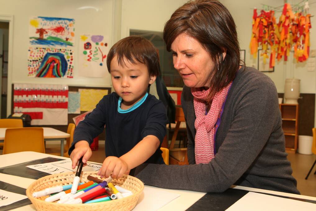 Reily Kelly, 3, from Warrnambool and teacher Kate Melican-Rollo at Warrnambool and District Kindergartens Open Day for students attending in 2014.